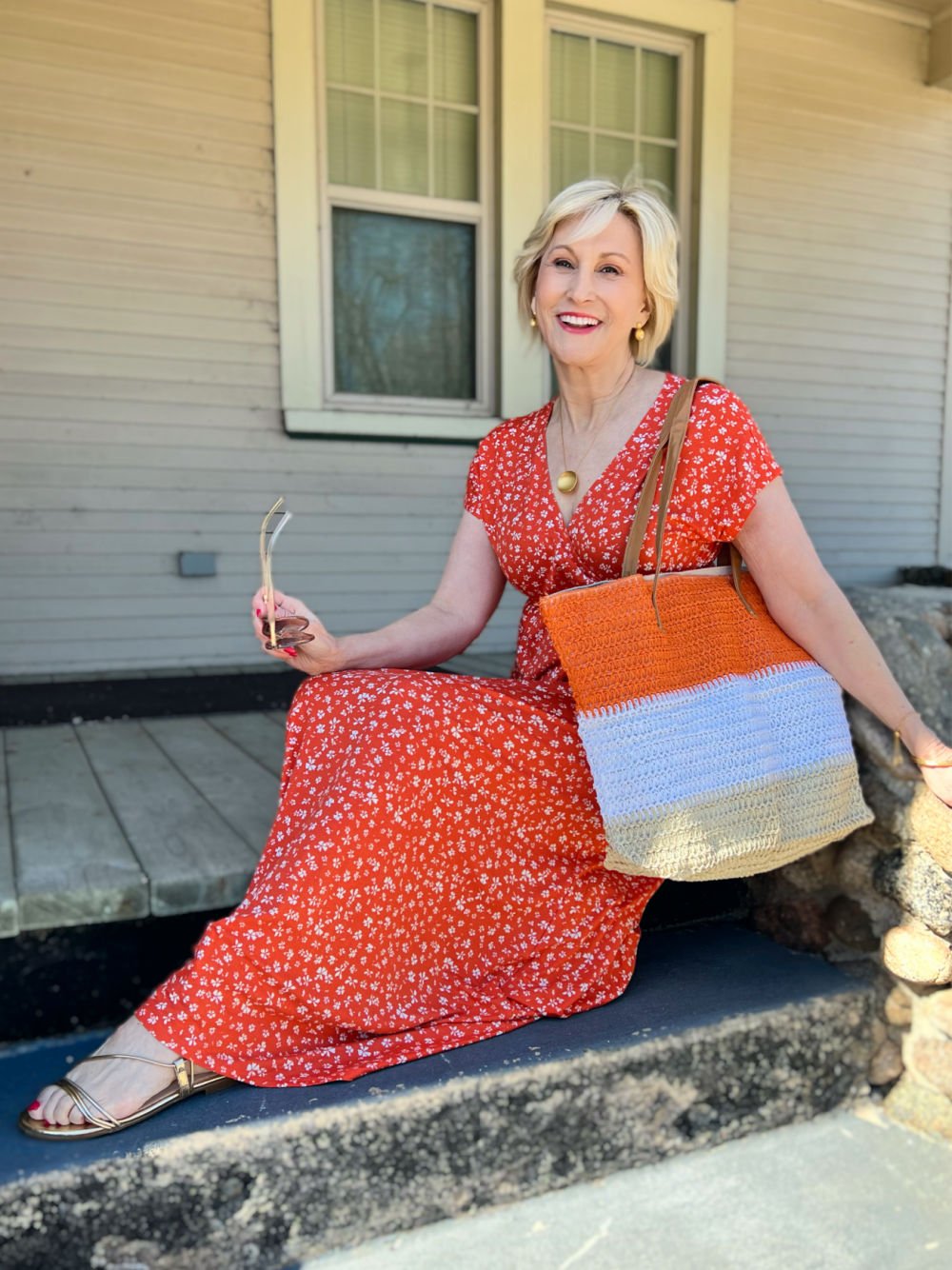 orange floral dress with orange striped straw tote Amazon