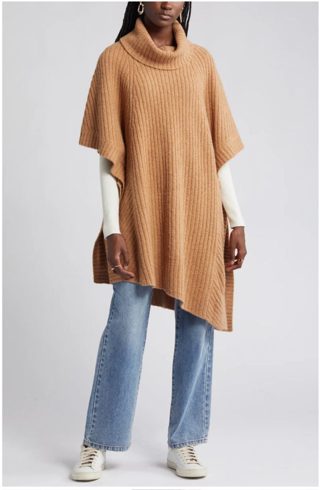 poncho and jeans