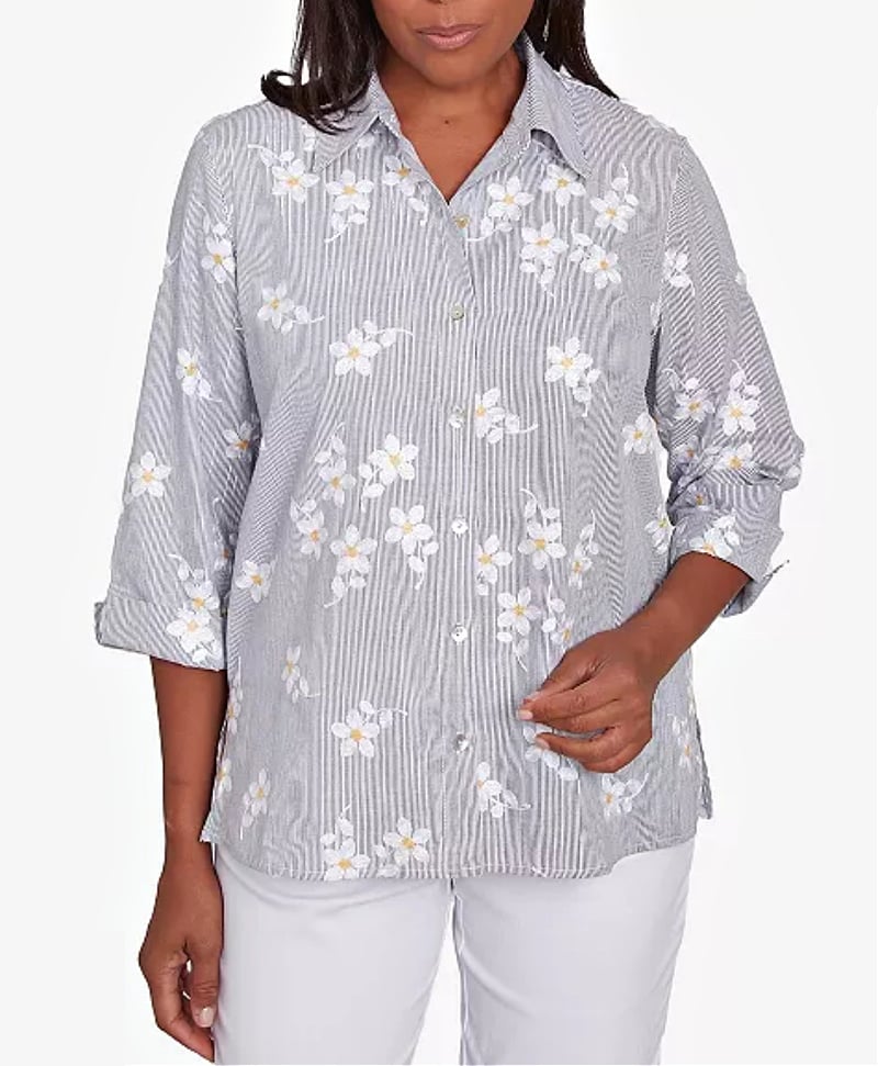 black and white striped top with embroidered flowers and cuffed sleeves